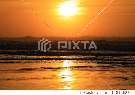 Clouds visible beyond the sunrise sky and the sea. Clouds visible beyond the sunrise sky and the sea. 138136272