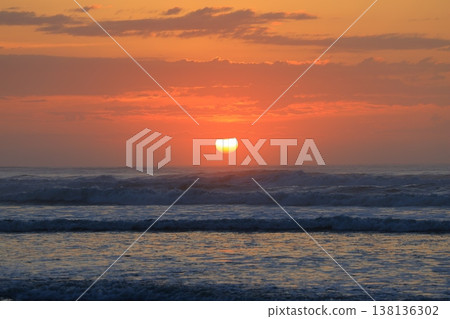 Clouds visible beyond the sunrise sky and the sea. Clouds visible beyond the sunrise sky and the sea. 138136302