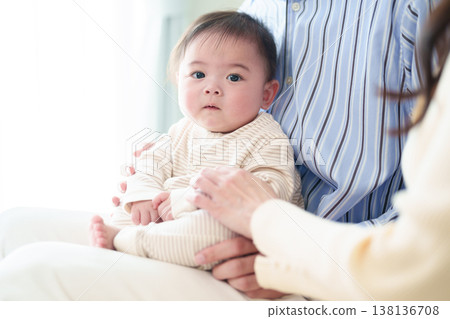 Baby looking at mother Baby looking at mother 138136708
