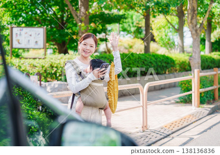 Mom calls a taxi with her baby Mom calls a taxi with her baby 138136836