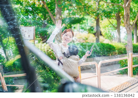Mom calls a taxi with her baby Mom calls a taxi with her baby 138136842