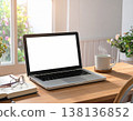 A laptop with a cup of coffee 138136852