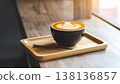 A cup of latte or cappuccino top view, on wooden plate 138136857