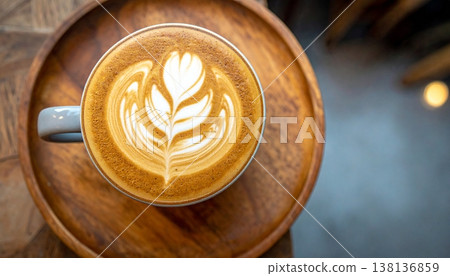 A cup of latte or cappuccino top view, on wooden plate A cup of latte or cappuccino top view, on wooden plate 138136859