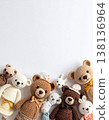 knitted bear dolls and animals in a flat lay with copy space for tex 138136964