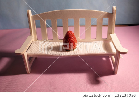 Strawberries on a table with a white chair Strawberries on a table with a white chair 138137056