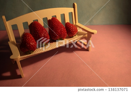 A wooden chair object placed on a chair on a table. 138137071