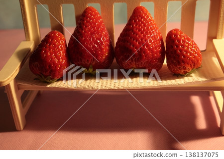 Strawberries on a white chair Strawberries on a white chair 138137075