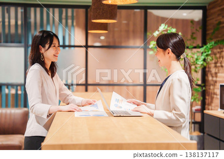Two women having a meeting in an office 138137117