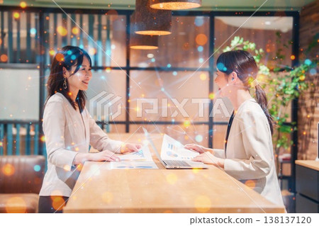 Two women having a meeting in an office 138137120