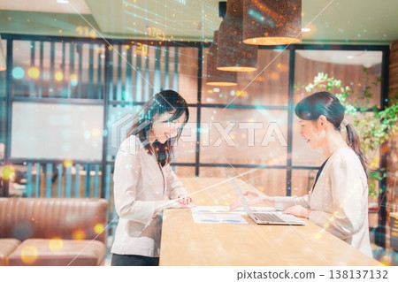 Two women having a meeting in an office Two women having a meeting in an office 138137132