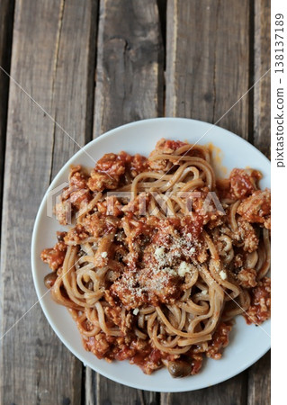 Gluten-free meat sauce pasta made with brown rice noodles 138137189
