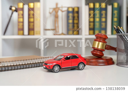 Legal concept with gavel, red car, and law books Legal concept with gavel, red car, and law books 138138039