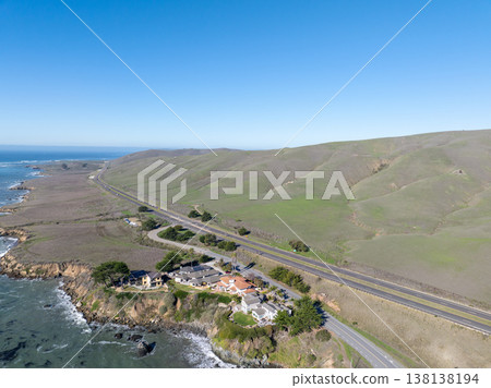 Aerial view of Cayucos, California USA, Pier, Ocean Ave and Shoreline Beach with Green Hills in San Luis Obispo County Aerial view of Cayucos, California USA, Pier, Ocean Ave and Shoreline Beach with Green Hills in San Luis Obispo County 138138194