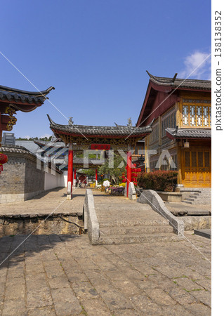 Lijiang, China - April 10, 2024 : : Tourist walking on the street of Lijiang old town street in Lijiang, China on April 10, 2024. Lijiang, China - April 10, 2024 : : Tourist walking on the street of Lijiang old town street in Lijiang, China on April 10, 2024. 138138352