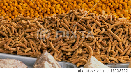 Fried snacks pile sold on market stall Fried snacks pile sold on market stall 138138522