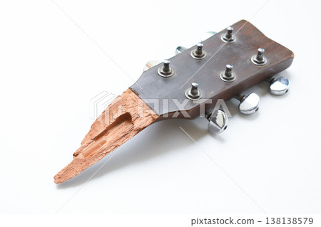 part of broken wood acoustic guitar isolated on white background 138138579