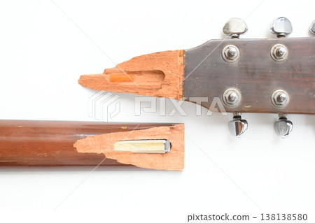 part of broken wood acoustic guitar isolated on white background 138138580