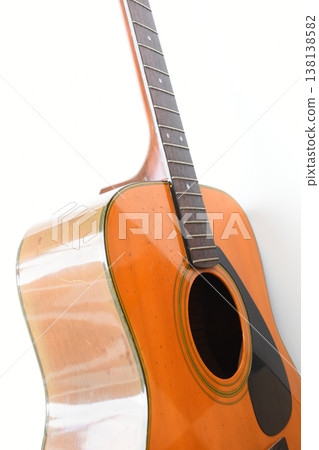 brown wood acoustic guitar isolated on white background 138138582