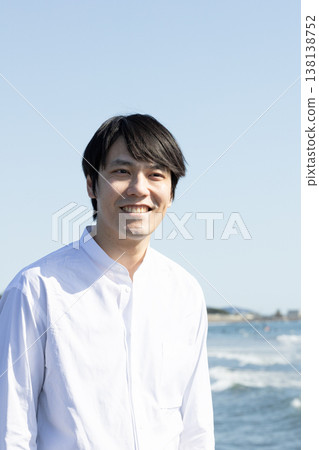 Men relaxing on the coast Men relaxing on the coast 138138752