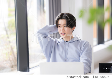 The image of a student struggling and feeling overwhelmed because they don't understand the lessons at a university campus or cram school. The image of a student struggling and feeling overwhelmed because they don't understand the lessons at a university campus or cram school. 138138806