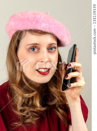Woman holding mobile phone 138139339