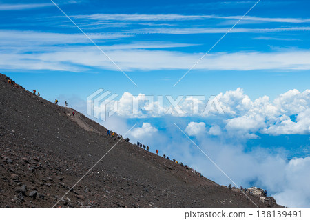 Climbers ascending Mount Fuji via the Subashiri route. Climbers ascending Mount Fuji via the Subashiri route. 138139491