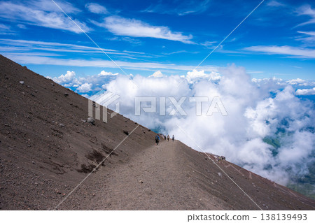 Climbers running down the sandy slopes of Mount Fuji Climbers running down the sandy slopes of Mount Fuji 138139493