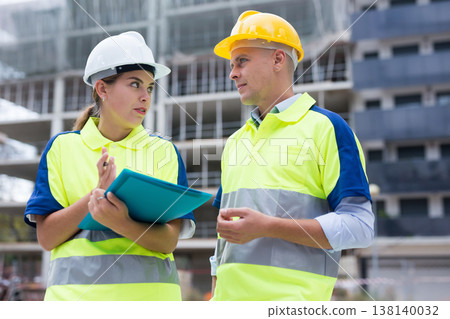 Civil engineers checking work process in construction site Civil engineers checking work process in construction site 138140032