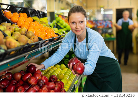 woman seller offers to buy apples woman seller offers to buy apples 138140236