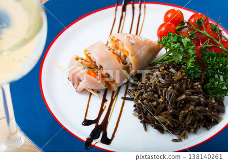 Stuffed squid with peppers, wild rice, eggs and herbs Stuffed squid with peppers, wild rice, eggs and herbs 138140261
