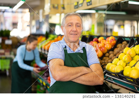 vegetable salesman in supermarket vegetable salesman in supermarket 138140291