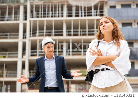 Depressed woman having problems at construction site Depressed woman having problems at construction site 138140321