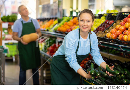 woman seller offers to buy zucchini woman seller offers to buy zucchini 138140454