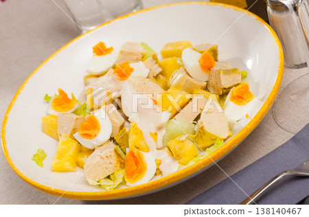 Dish with appetizing chicken salad, eggs and pineapples Dish with appetizing chicken salad, eggs and pineapples 138140467