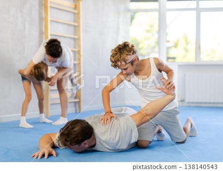 Parents and children during training and self-defense workout. Parents and children during training and self-defense workout. 138140543