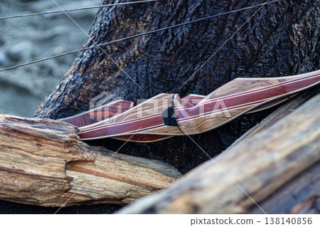 Two Bows Set Aside On Driftwood Two Bows Set Aside On Driftwood 138140856