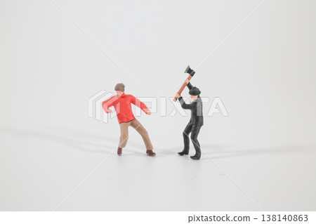Miniature Figures Enact Dramatic Scene on Clean Studio Surface Miniature Figures Enact Dramatic Scene on Clean Studio Surface 138140863