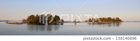 Forest covered small islands near the shore of Lake Vanern, Sweden. Forest covered small islands near the shore of Lake Vanern, Sweden. 138140896
