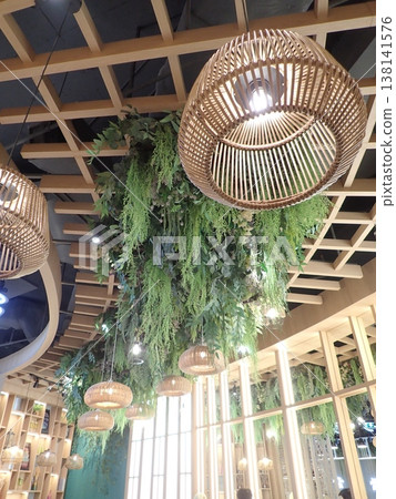 A design space where you can look up at the green ceiling; the interior features beautiful wooden lattice work and lighting. A design space where you can look up at the green ceiling; the interior features beautiful wooden lattice work and lighting. 138141576