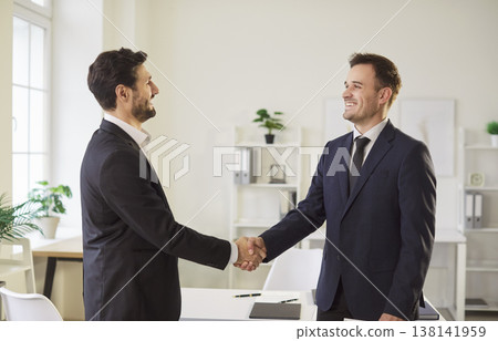 Happy Business People Shaking Hands And Working Together In Office Meeting 138141959