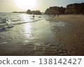 Golden hour idyllic vacation beach scene Algarve Portugal Praia do Amado 138142427
