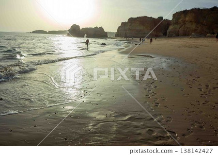 Golden hour idyllic vacation beach scene Algarve Portugal Praia do Amado Golden hour idyllic vacation beach scene Algarve Portugal Praia do Amado 138142427