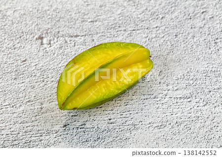 Fresh starfruit or carambola on a textured background. Fresh starfruit or carambola on a textured background. 138142552