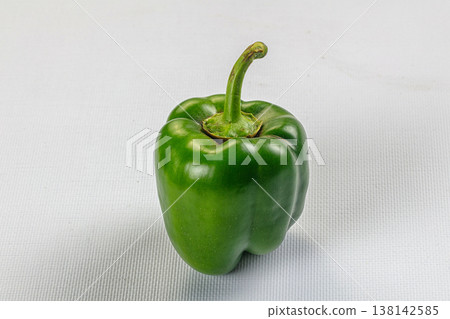 Fresh green bell peppers on a rustic table Fresh green bell peppers on a rustic table 138142585