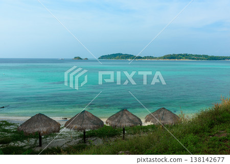 Beautiful Andaman sea, Tropical Turquoise clear blue sea and white sand beach on pattaya beach with blue sky background - summer vacation travel. at Tarutao national park and Koh Lipe in Satun, Beautiful Andaman sea, Tropical Turquoise clear blue sea and white sand beach on pattaya beach with blue sky background - summer vacation travel. at Tarutao national park and Koh Lipe in Satun, 138142677