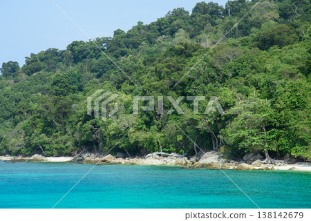 Beautiful Andaman sea, Tropical Turquoise clear blue sea and white sand beach on pattaya beach with blue sky background - summer vacation travel. at Tarutao national park and Koh Lipe in Satun, Beautiful Andaman sea, Tropical Turquoise clear blue sea and white sand beach on pattaya beach with blue sky background - summer vacation travel. at Tarutao national park and Koh Lipe in Satun, 138142679