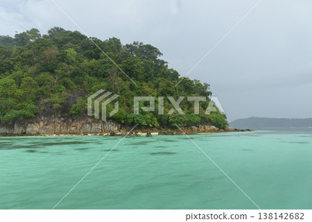 Beautiful Andaman sea, Tropical Turquoise clear blue sea and white sand beach on pattaya beach with blue sky background - summer vacation travel. at Tarutao national park and Koh Lipe in Satun, Beautiful Andaman sea, Tropical Turquoise clear blue sea and white sand beach on pattaya beach with blue sky background - summer vacation travel. at Tarutao national park and Koh Lipe in Satun, 138142682