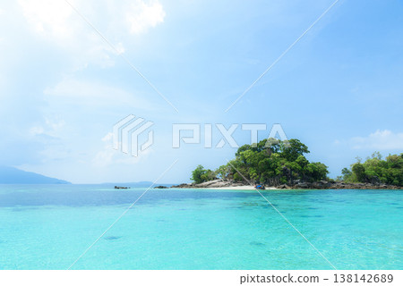 Beautiful Andaman sea, Tropical Turquoise clear blue sea and white sand beach on pattaya beach with blue sky background - summer vacation travel. at Tarutao national park and Koh Lipe in Satun, Beautiful Andaman sea, Tropical Turquoise clear blue sea and white sand beach on pattaya beach with blue sky background - summer vacation travel. at Tarutao national park and Koh Lipe in Satun, 138142689