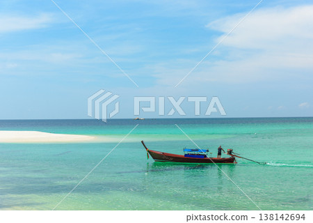 Beautiful Andaman sea, Tropical Turquoise clear blue sea and white sand beach on pattaya beach with blue sky background - summer vacation travel. at Tarutao national park and Koh Lipe in Satun, Beautiful Andaman sea, Tropical Turquoise clear blue sea and white sand beach on pattaya beach with blue sky background - summer vacation travel. at Tarutao national park and Koh Lipe in Satun, 138142694